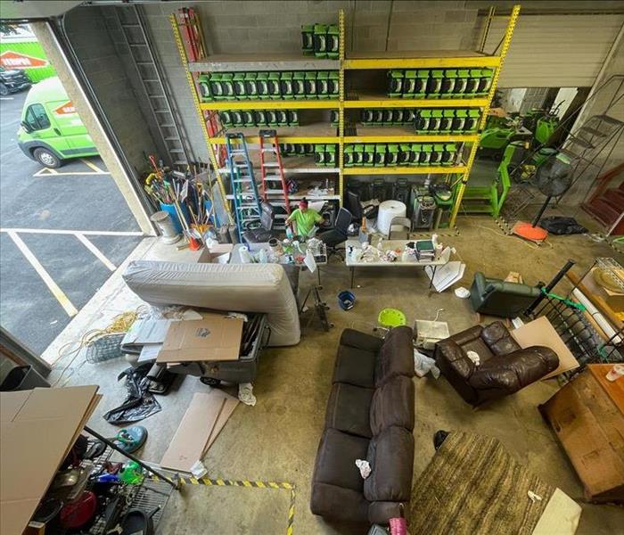 SERVPRO warehouse with restoration equipment and furniture