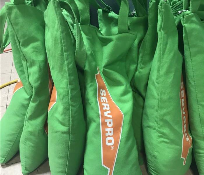 green servpro logo on canvas bags
