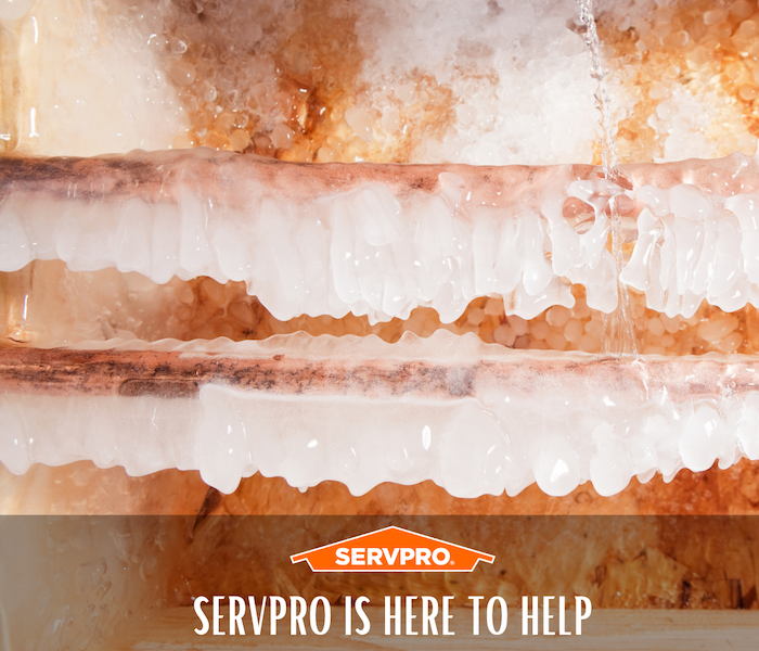 Frozen pipes with a label reading: SERVPRO is here to help