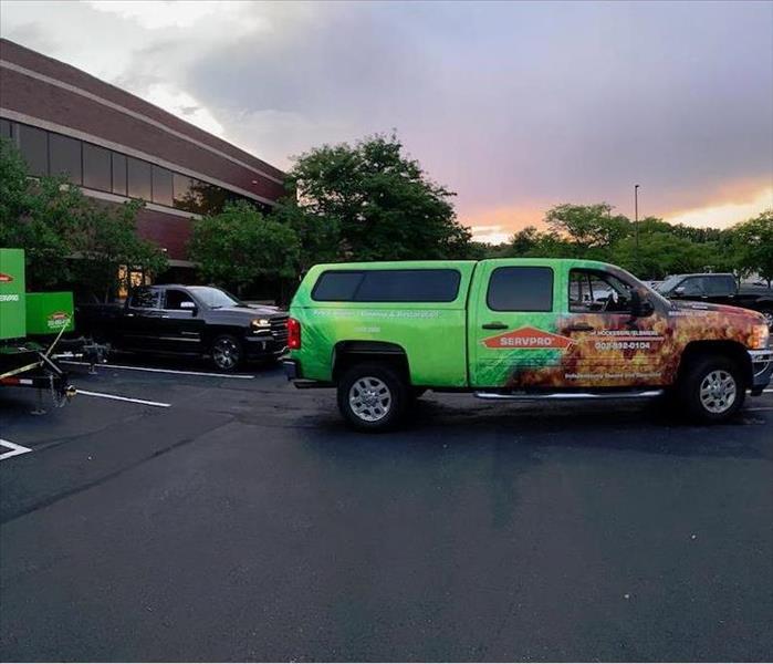 SERVPRO trucks and equipment outside of a work location