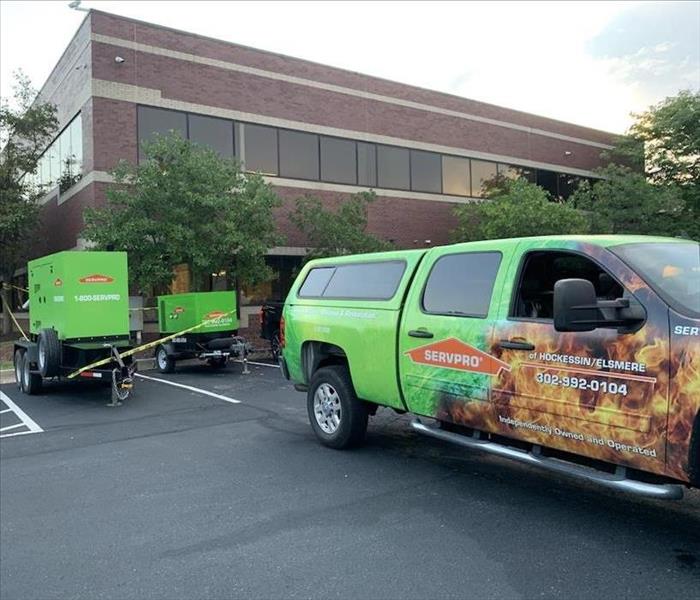 SERVPRO vehicle and equipment outside job site.