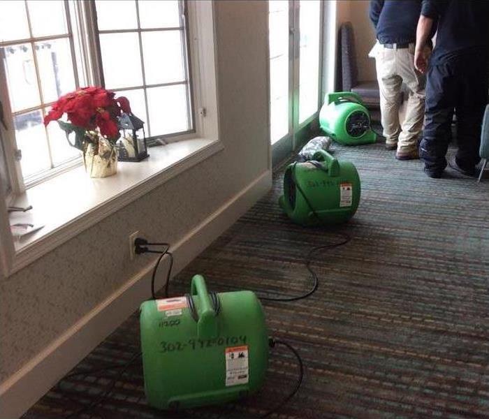 Our air movers drying the carpet in this home